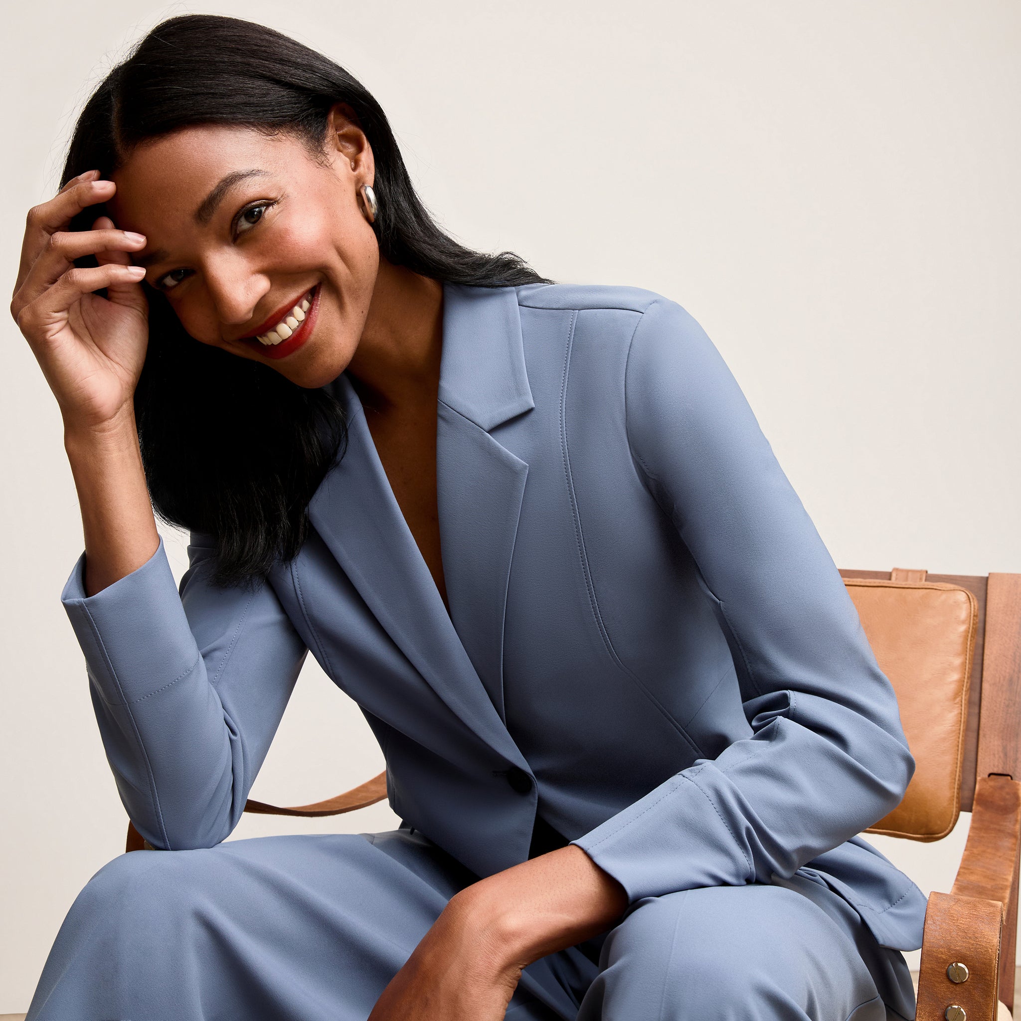 Front image of a woman wearing Moreland Travel Blazer - OrigamiTech :: Dusty Blue