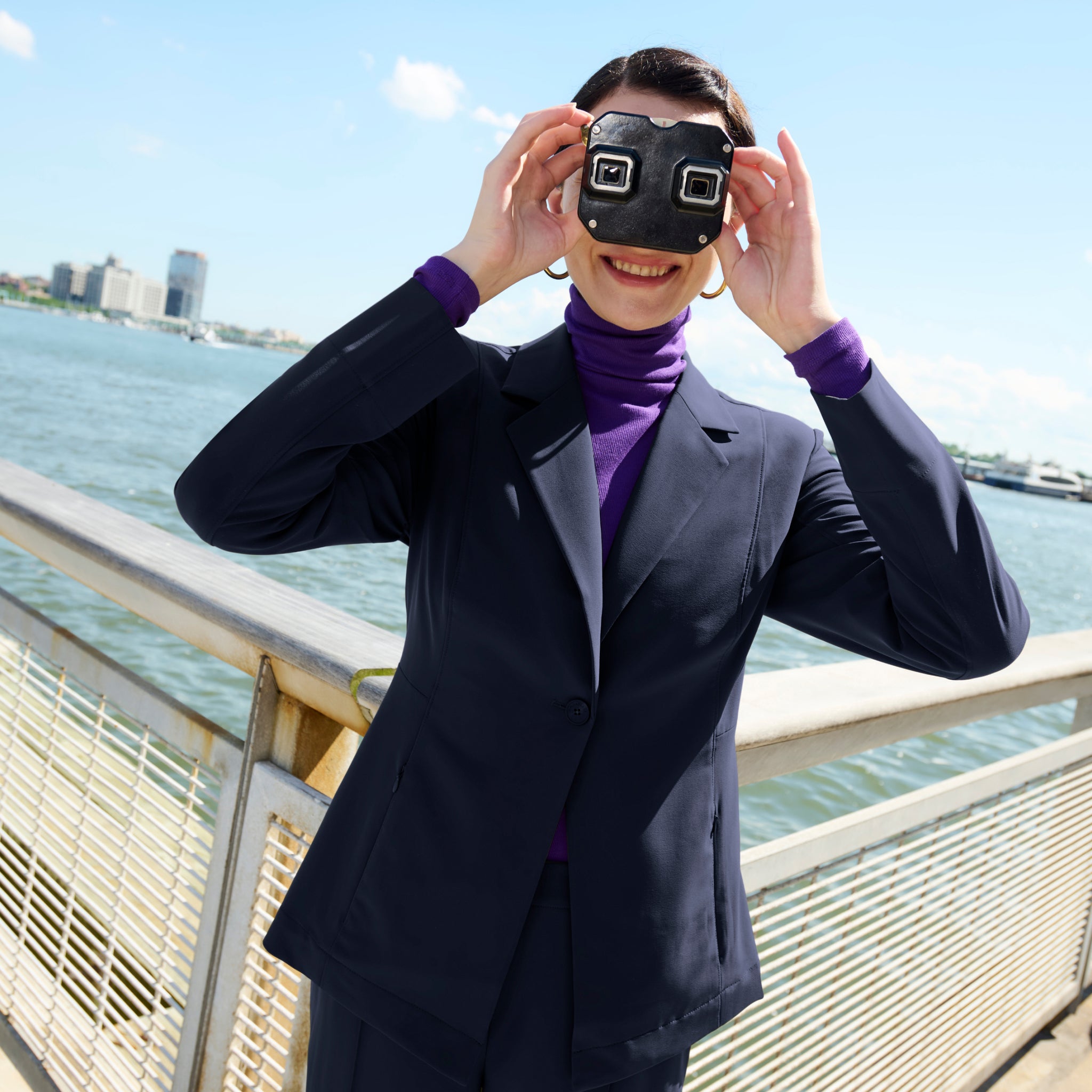 front image of a woman wearing the moreland jacket in dark navy