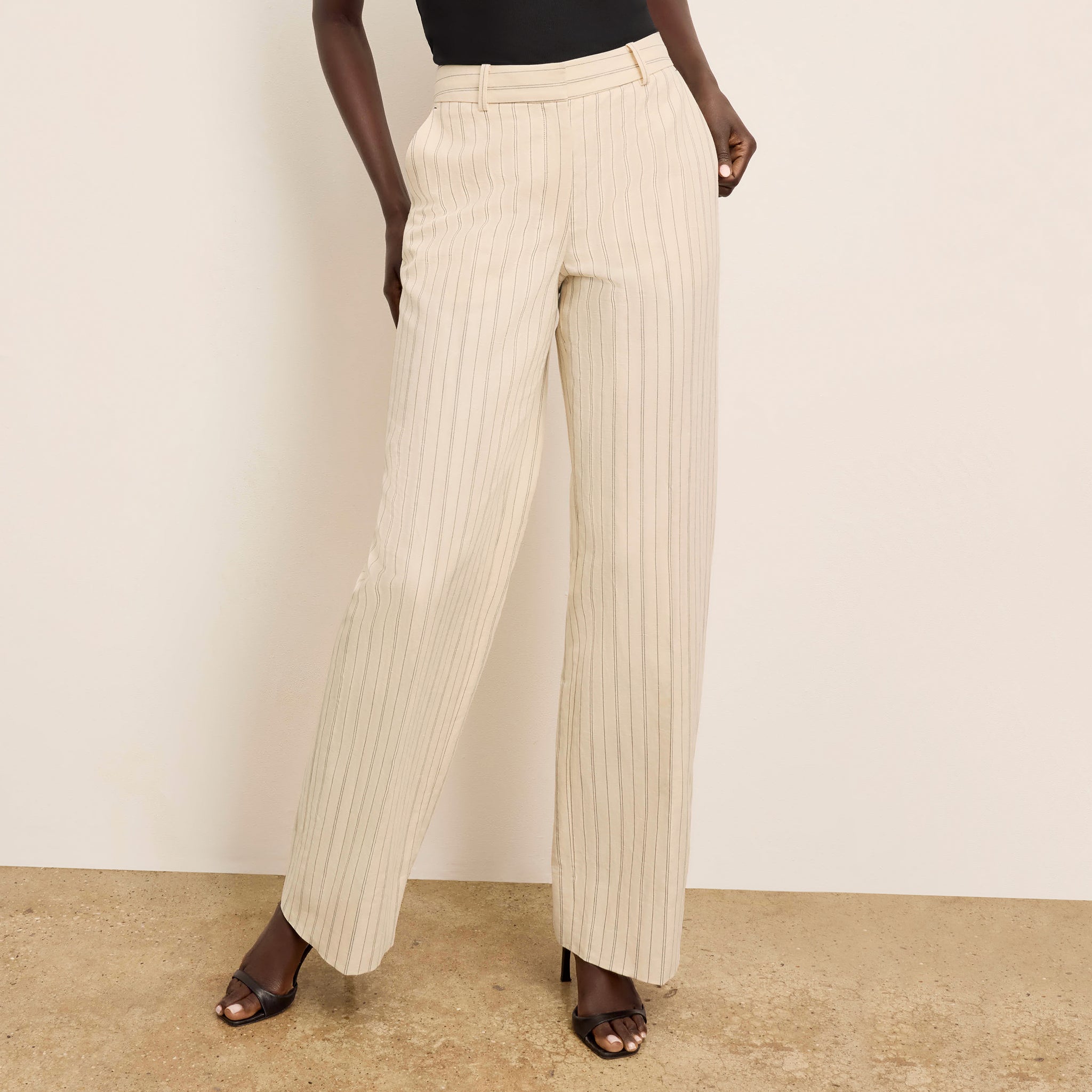 front image of a woman wearing the tinsley pant in linen stripe 