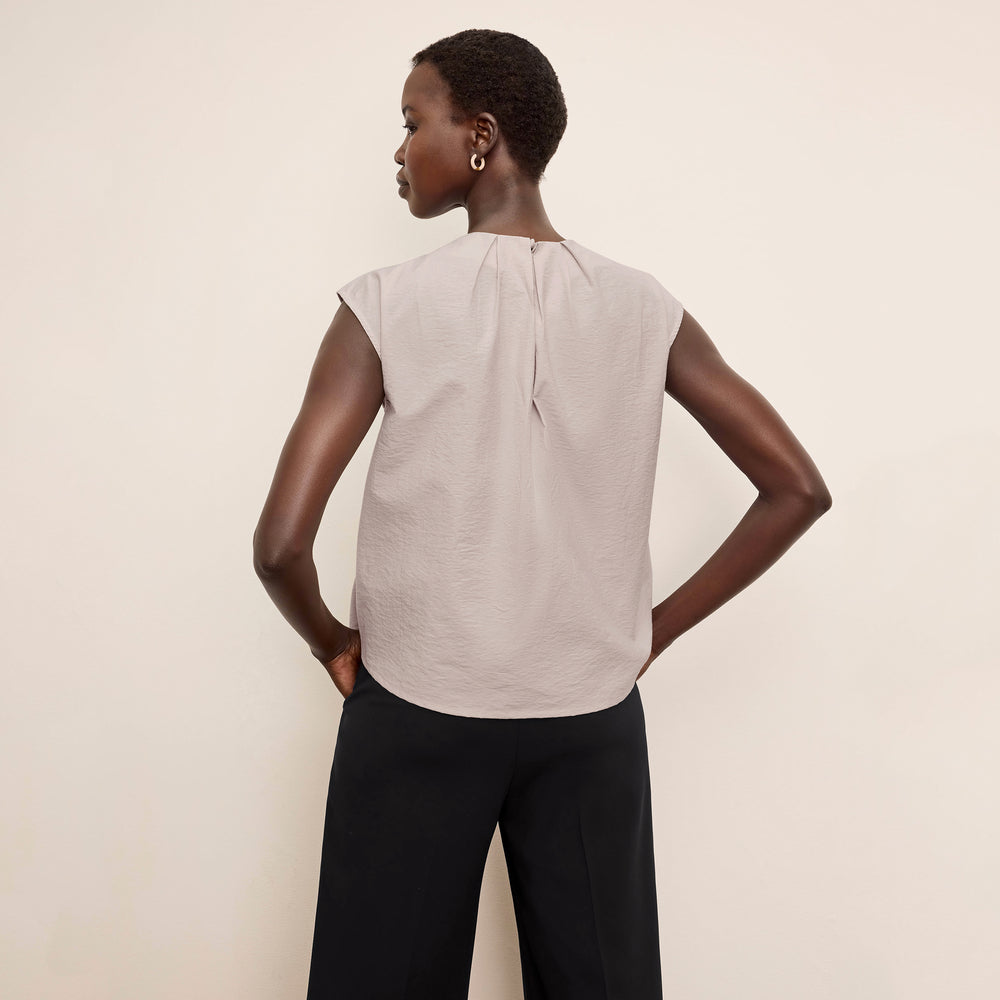 Back image of a woman wearing the Nika Top in Quartz Voile