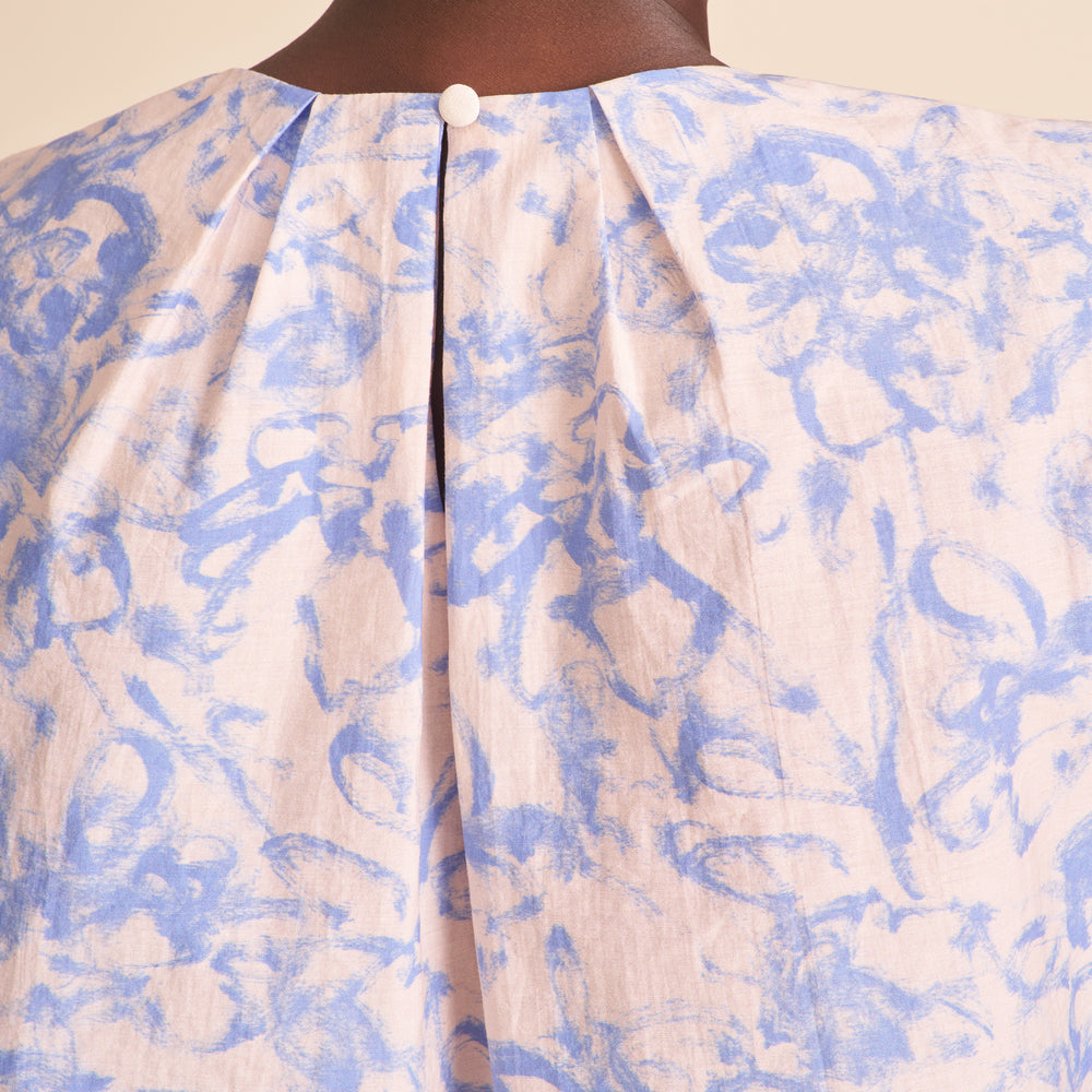 Close-up of a garment with blue and white abstract pattern