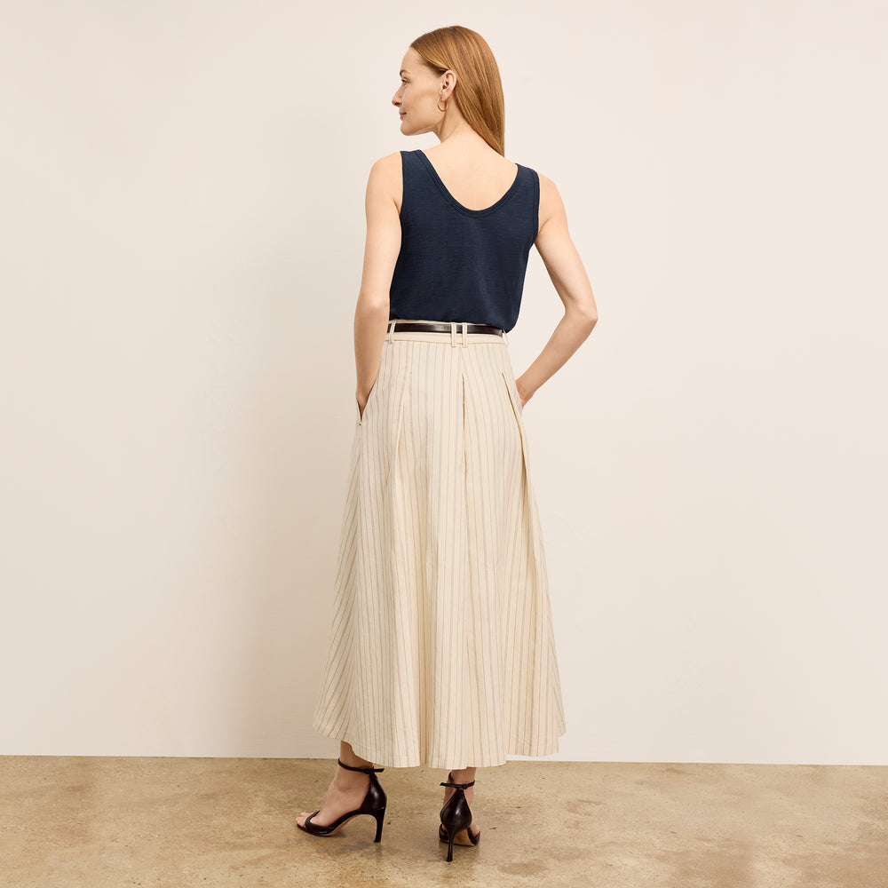 back image of a woman wearing the olia skirt in linen stripe