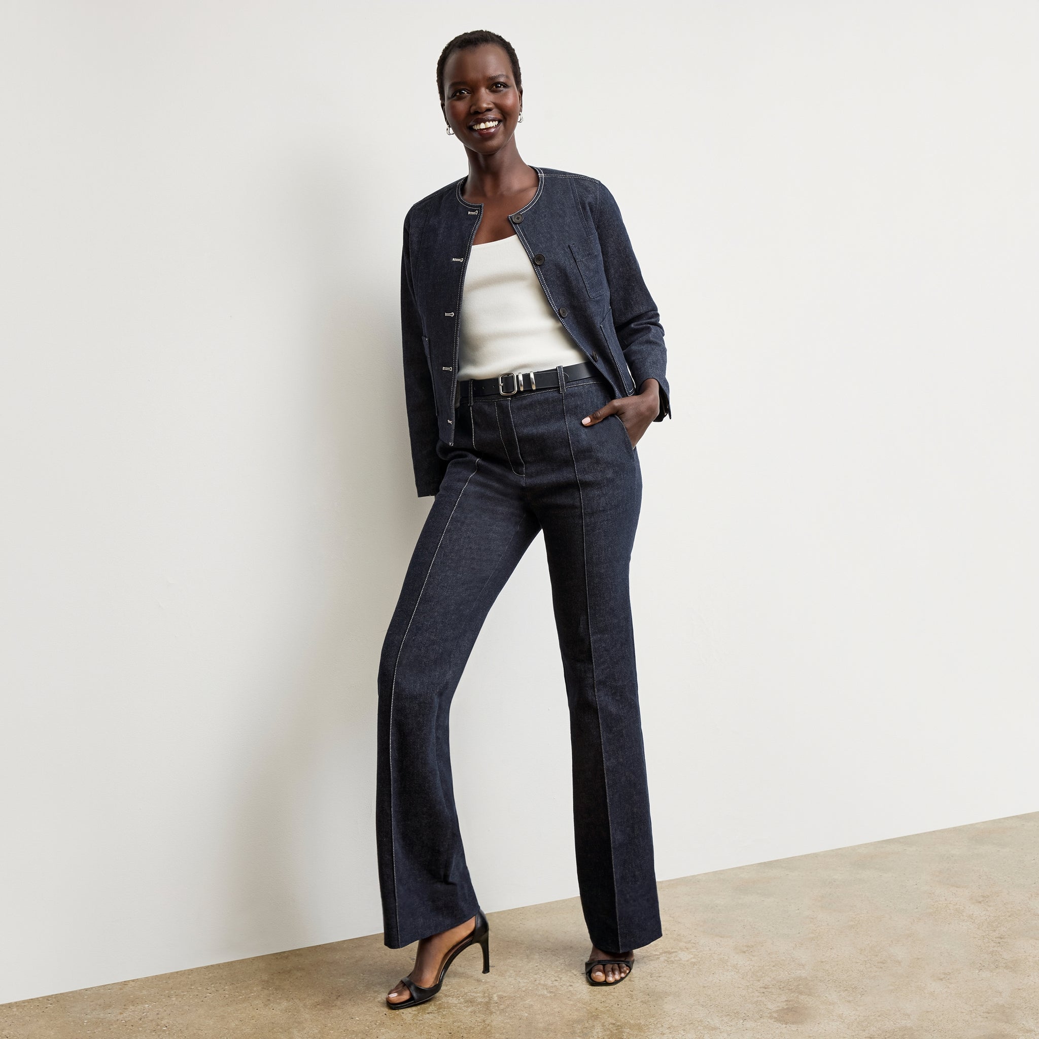 front image of a woman wearing the rowe pant in midnight wash