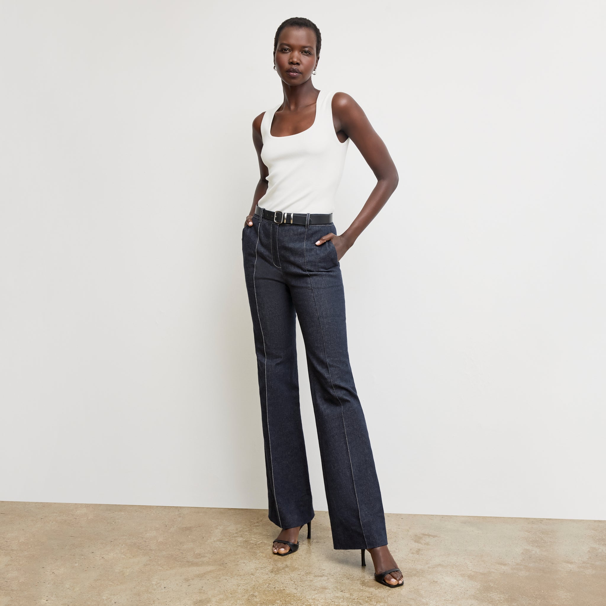 front image of a woman wearing the rowe pant in midnight wash