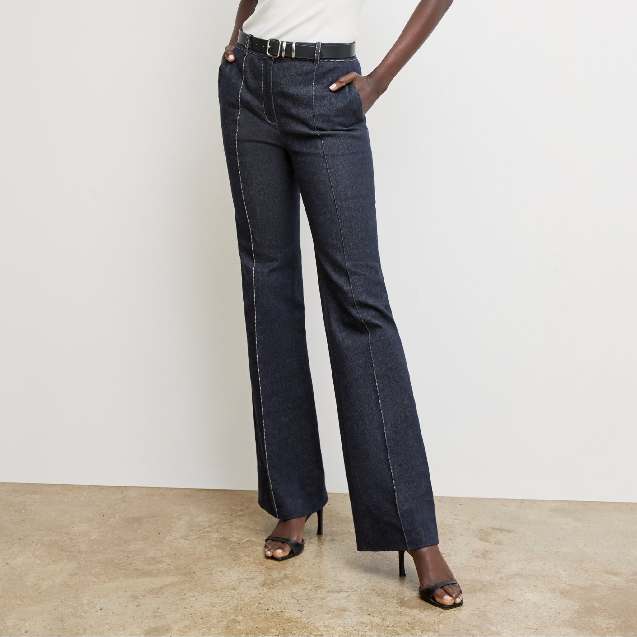 front image of a woman wearing the rowe pant in midnight wash 