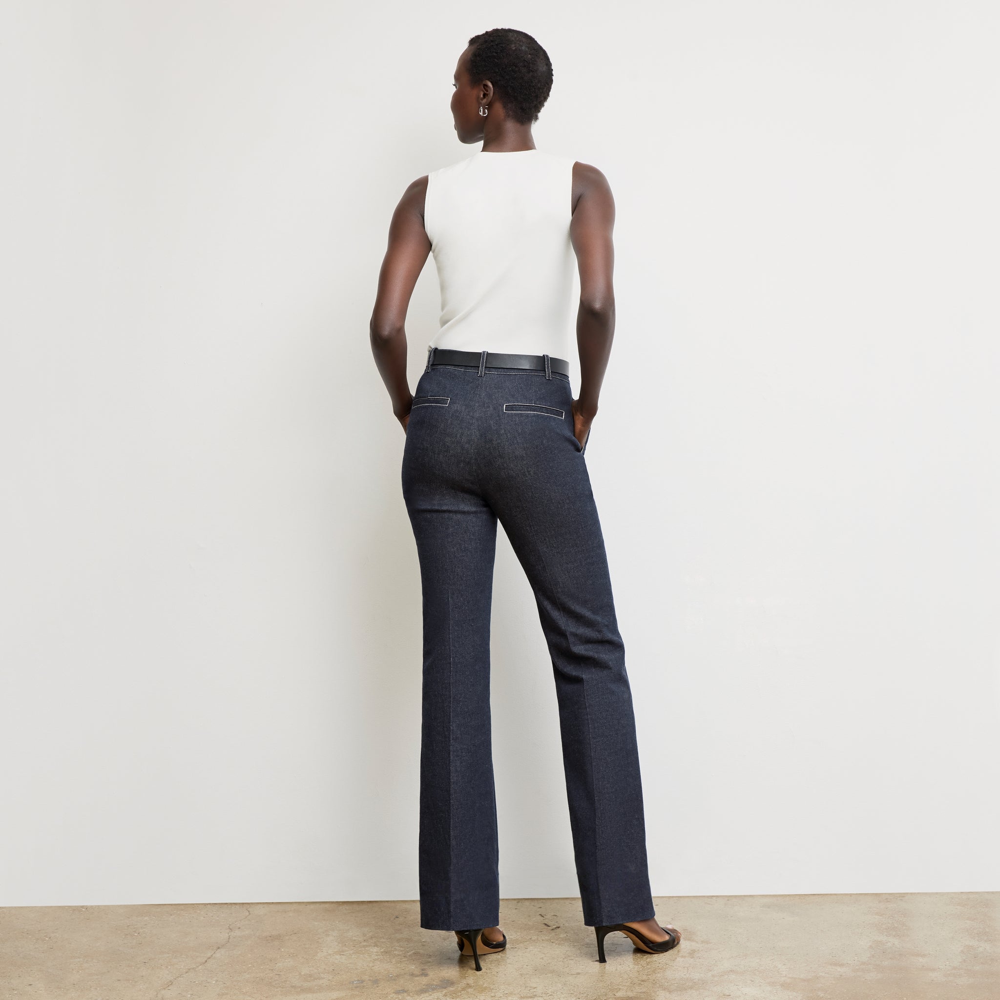 back image of a woman wearing the rowe pant in midnight wash