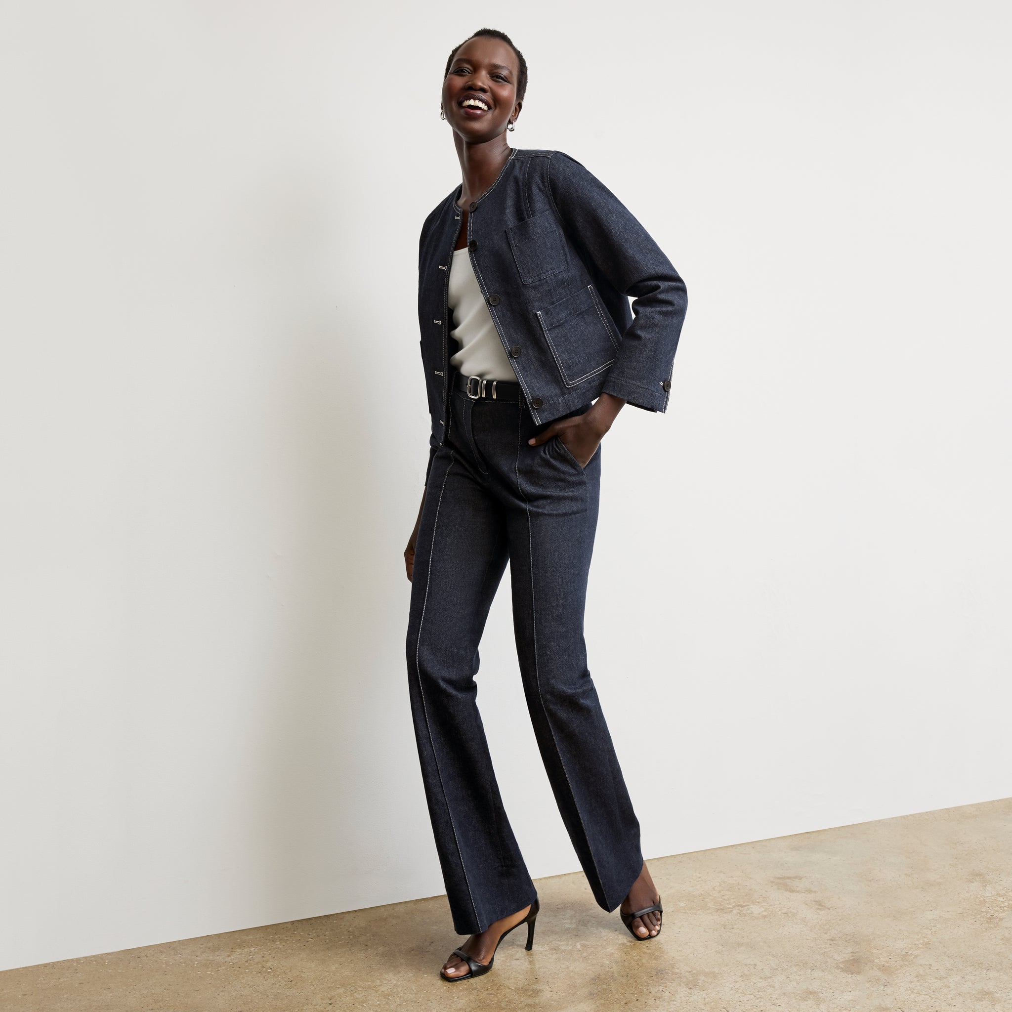 front image of a woman wearing the rowe pant in midnight wash