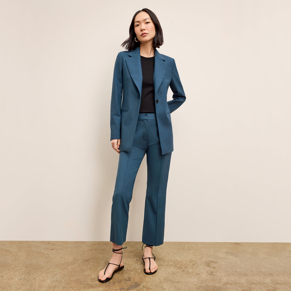 front image of a woman wearing the rossi jacket in bluebell