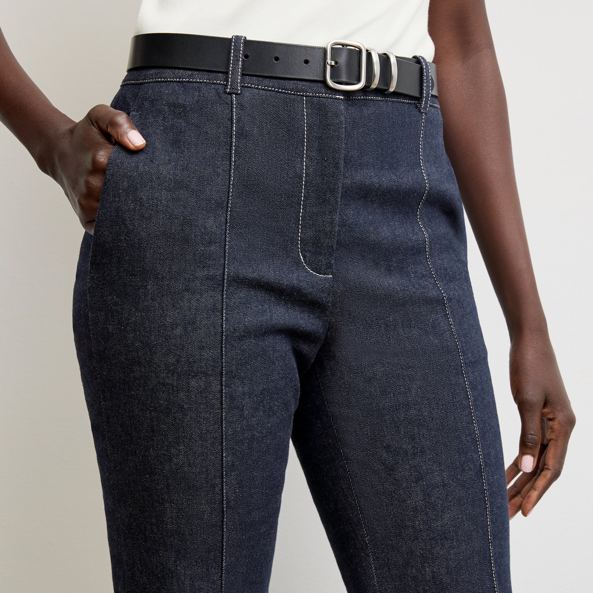 front image of a woman wearing the rowe pant in midnight wash