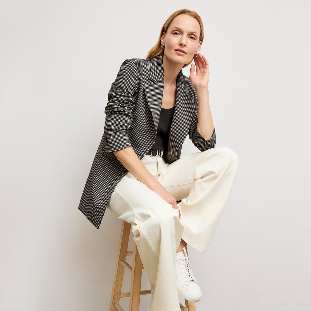 front image of a woman wearing the sabine top in black