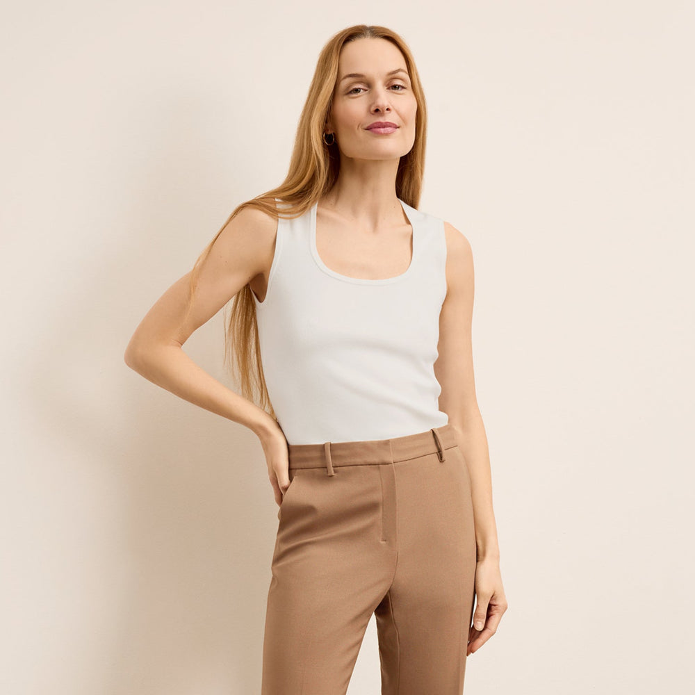 front image of a woman wearing the sabine top in ivory