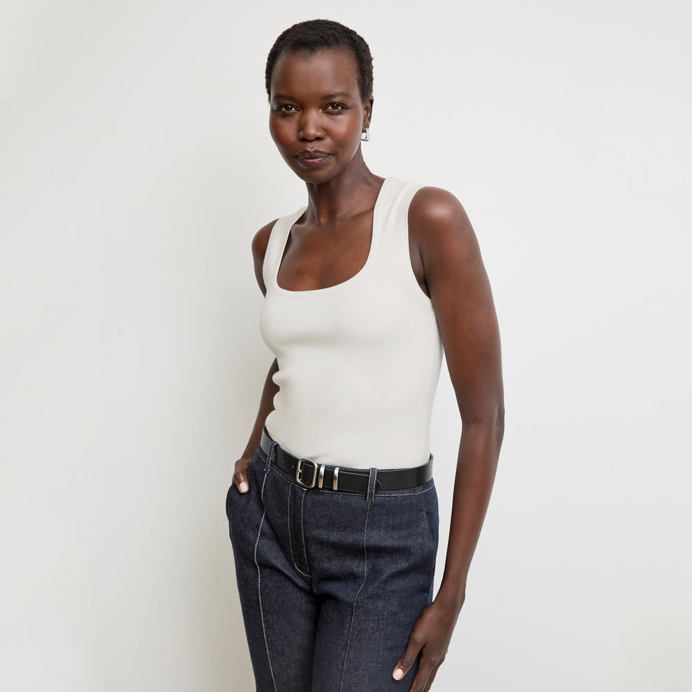 front image of a woman wearing the sabine top in ivory