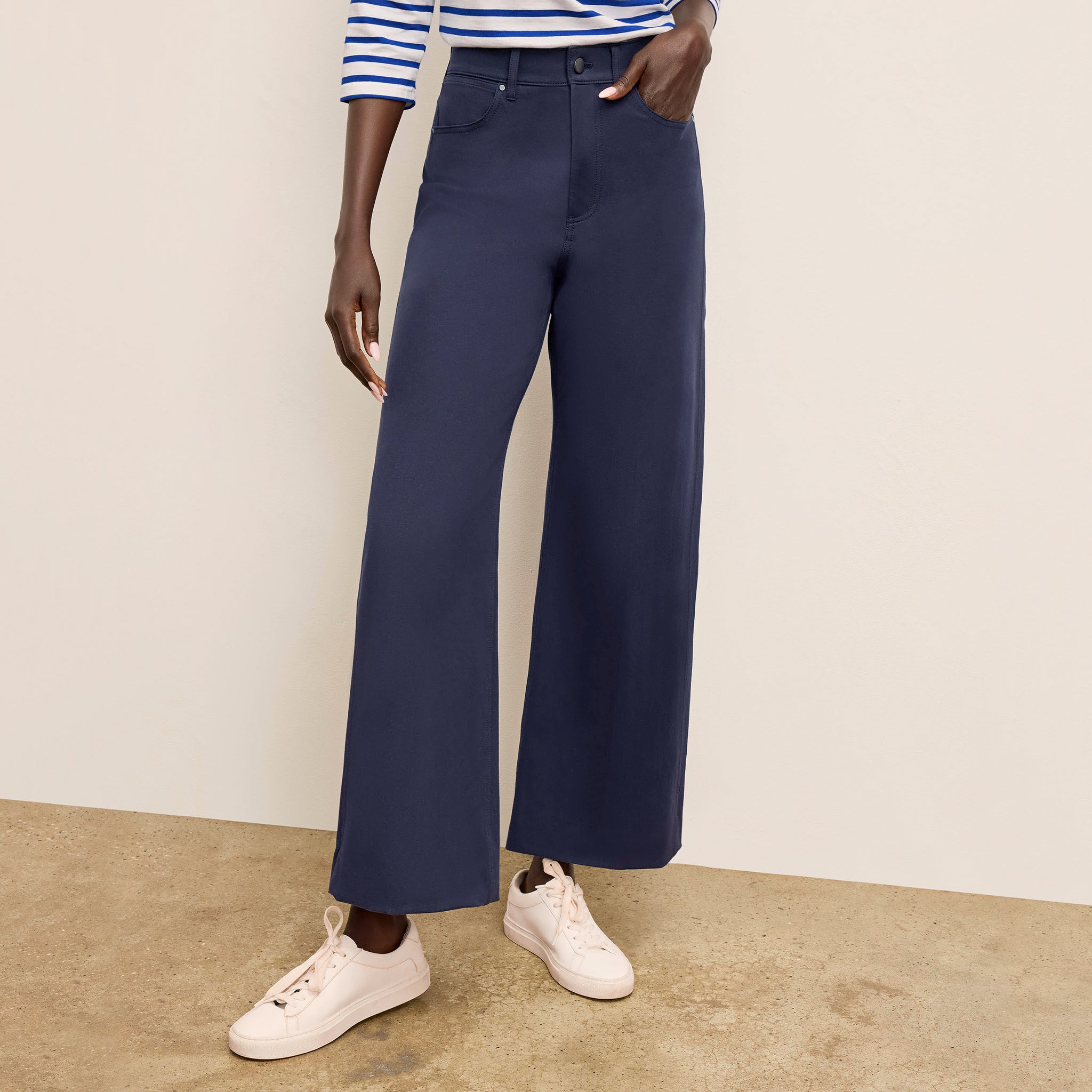 Front image of a woman standing wearing the Milo Jean in ink