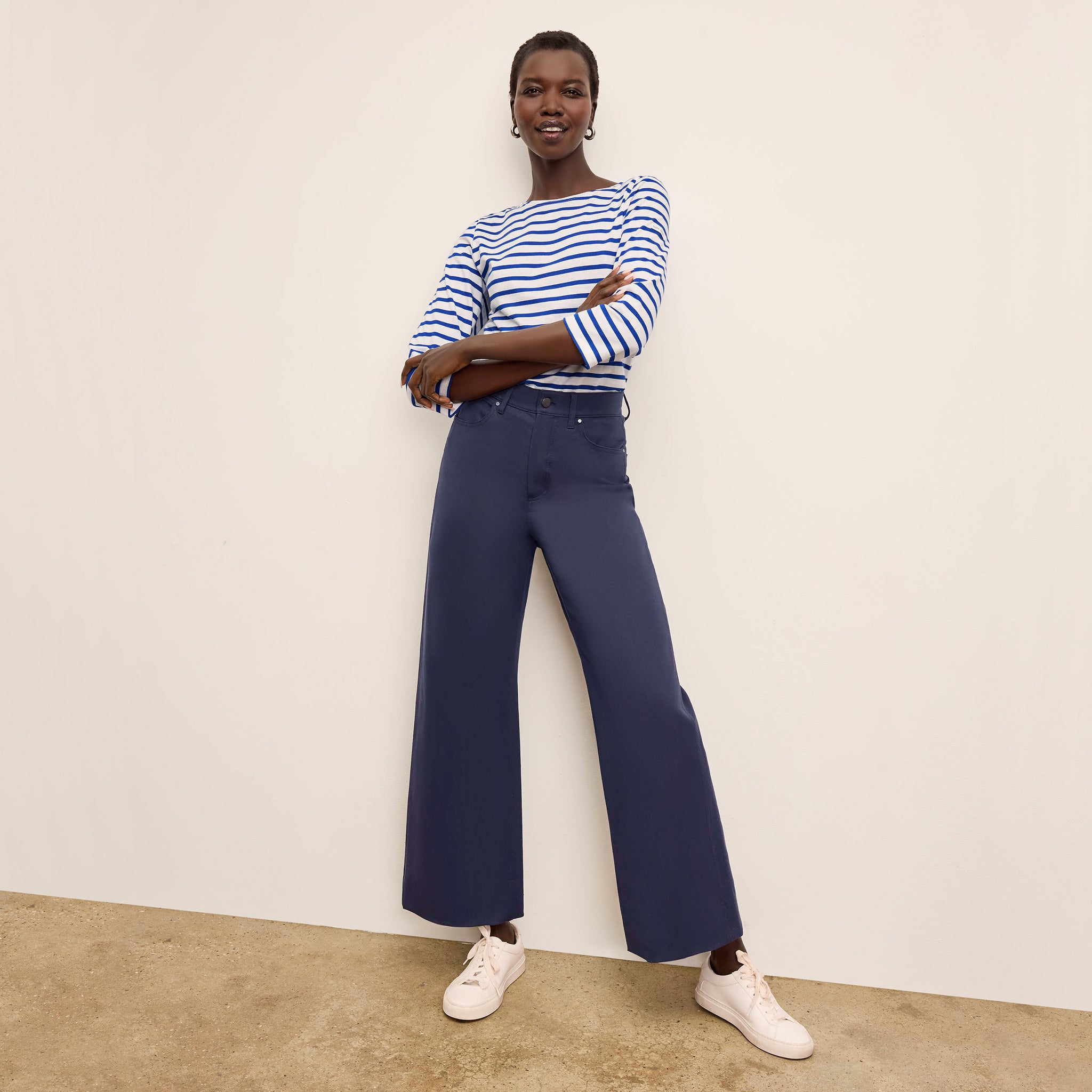 Front image of a woman standing wearing the Milo Jean in ink