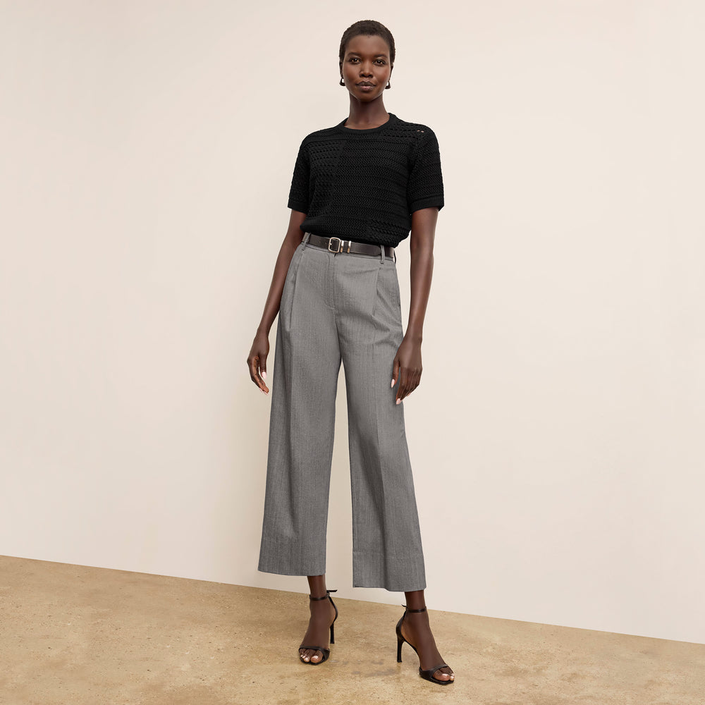 Front image of a woman wearing the Sina top in black