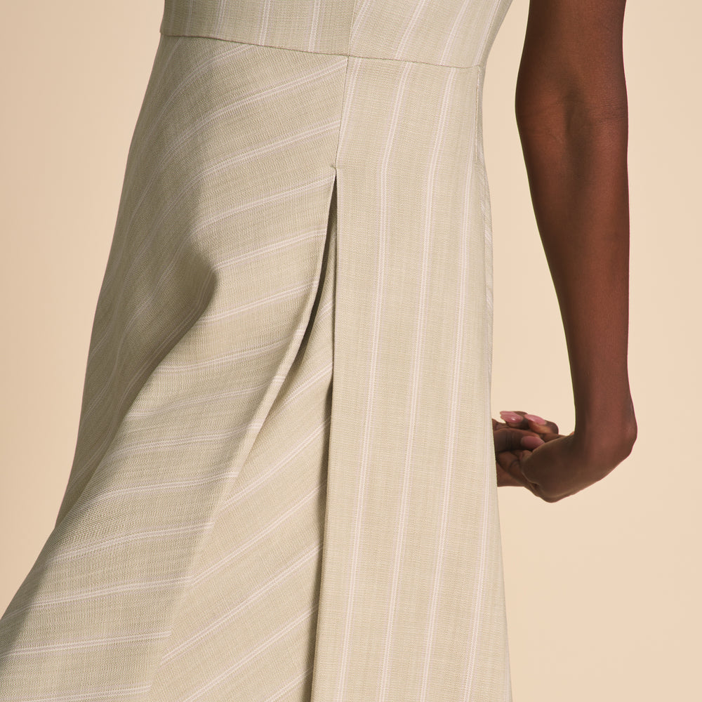 Beige pinstripe dress with a neutral background