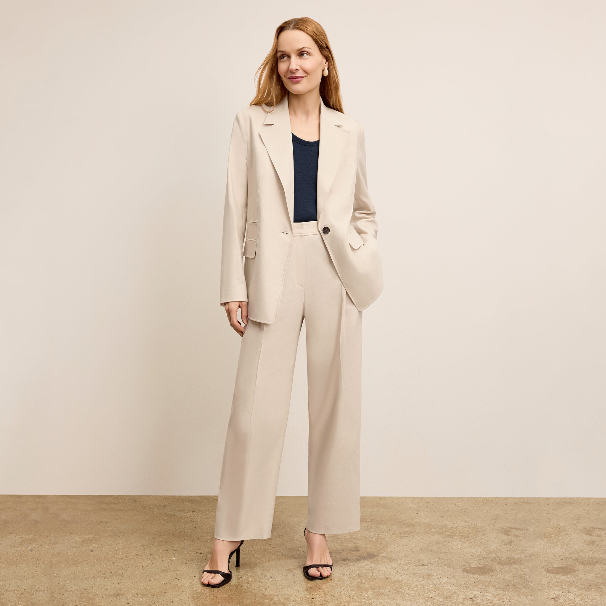 front image of a woman wearing the arlo pant in natural 