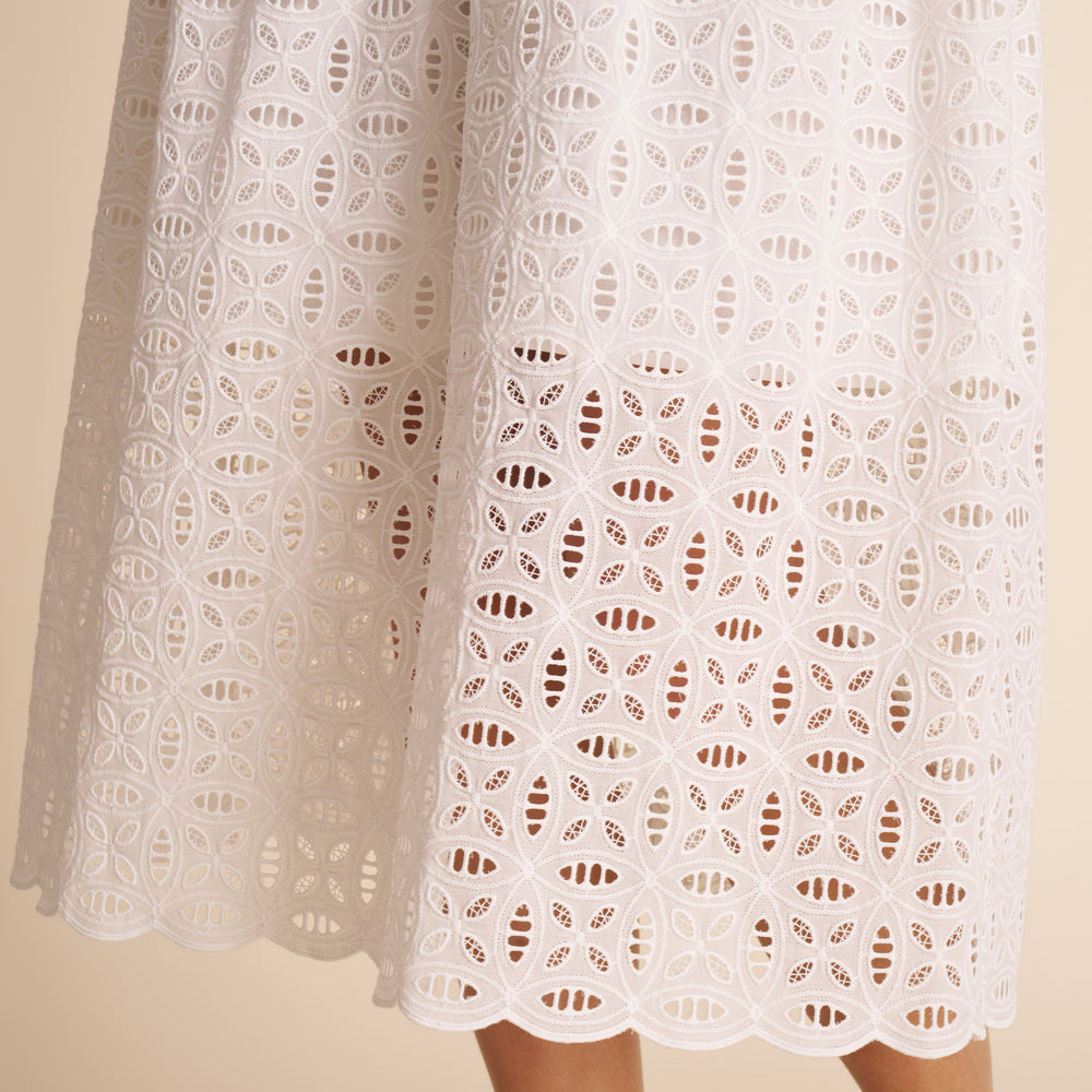up close shot of woman in white dress.