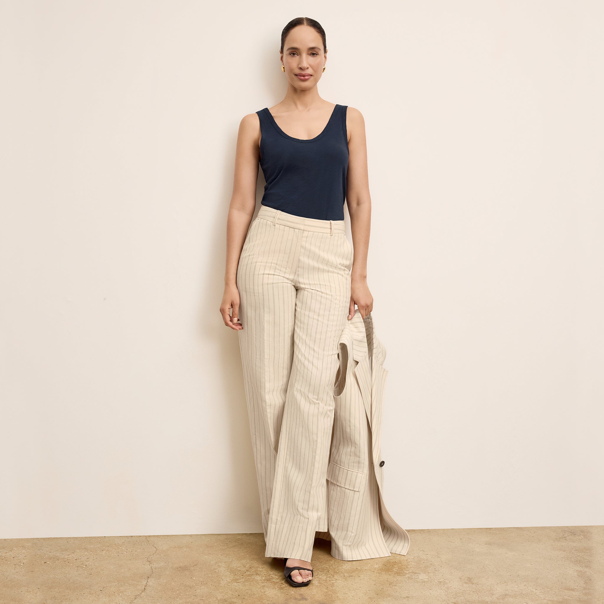 front image of a woman wearing the tinsley pant in linen stripe