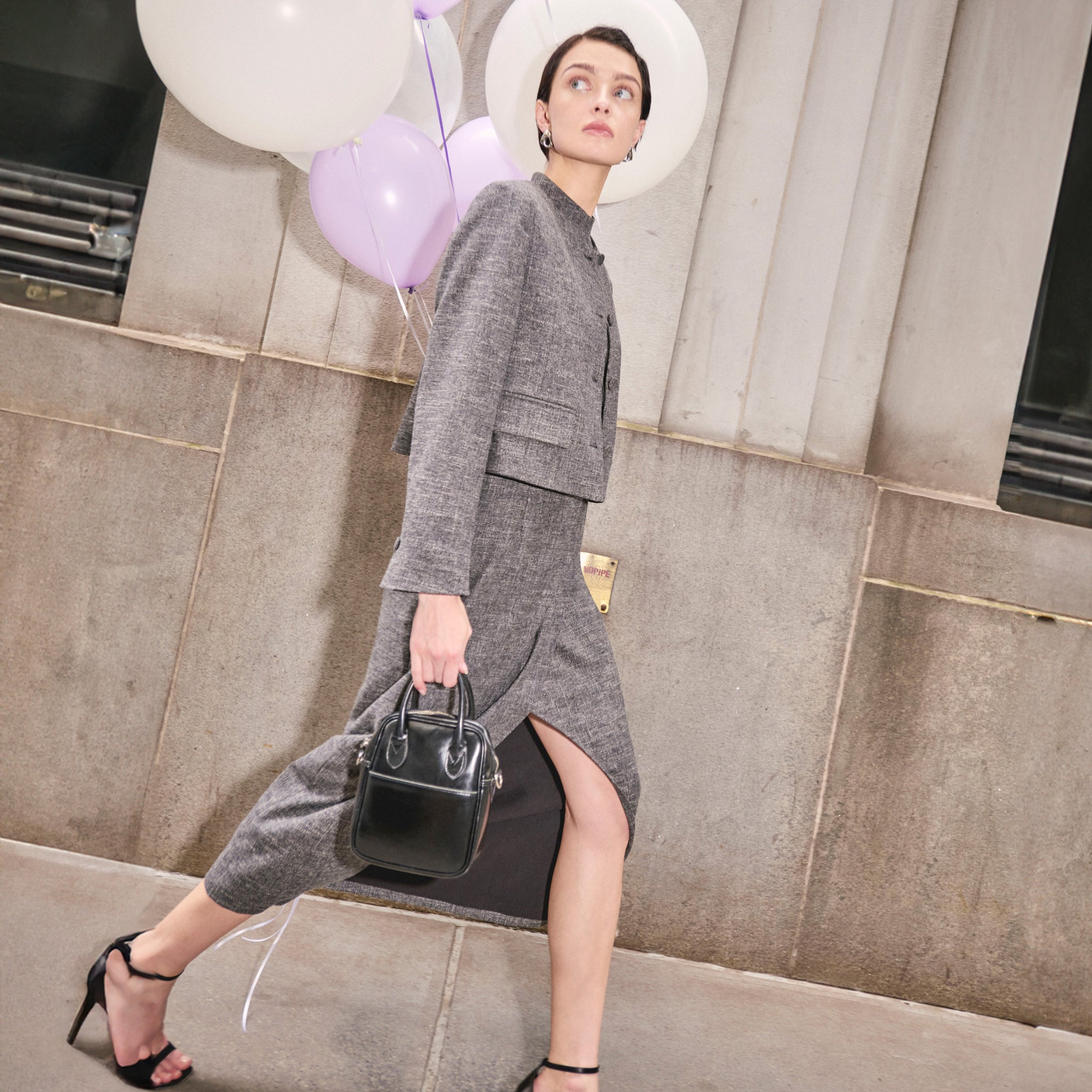 image of a woman wearing the valencia dress in black/white 