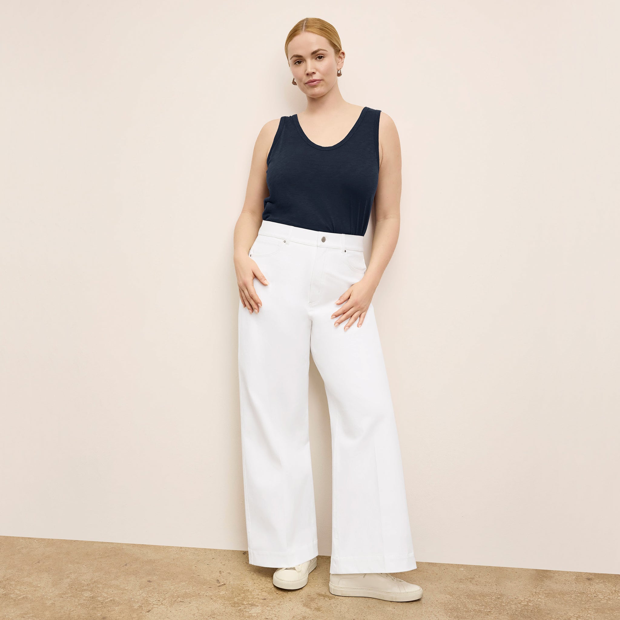 front image of a woman wearing the milo jeans in white