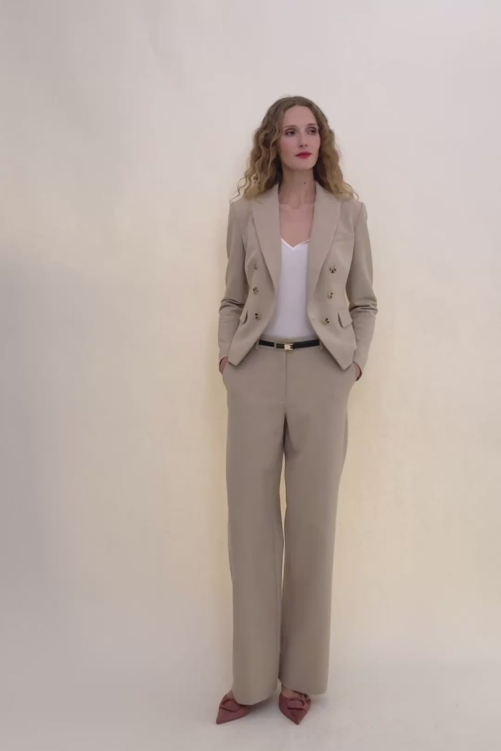 woman in beige suit.