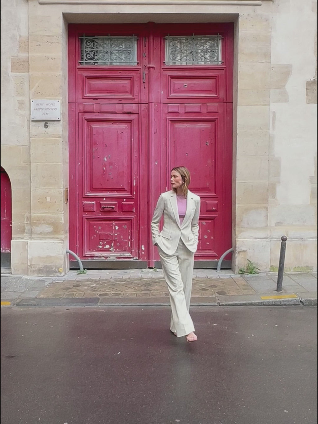 woman in linen stripe blazer with matching pants.