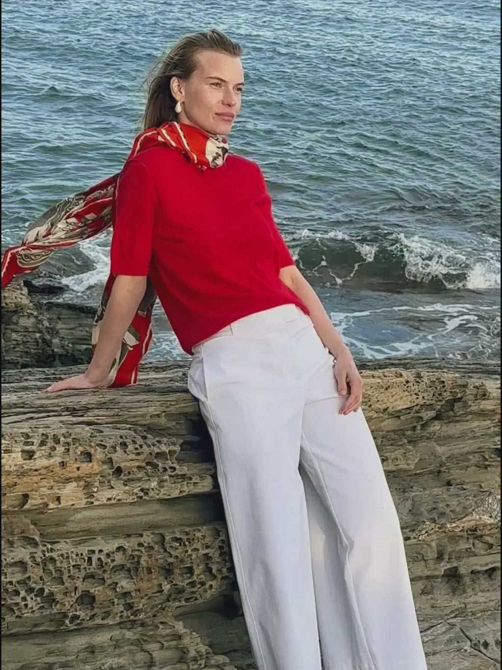woman in red shirt with a scarf.