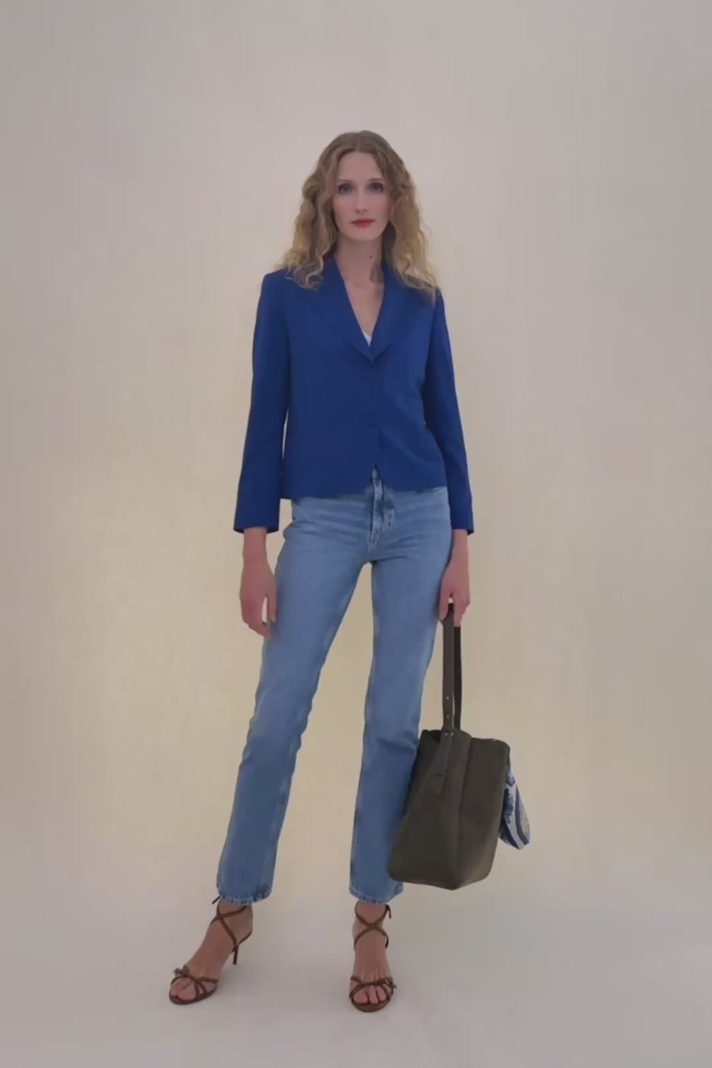 woman in royal blue blazer.