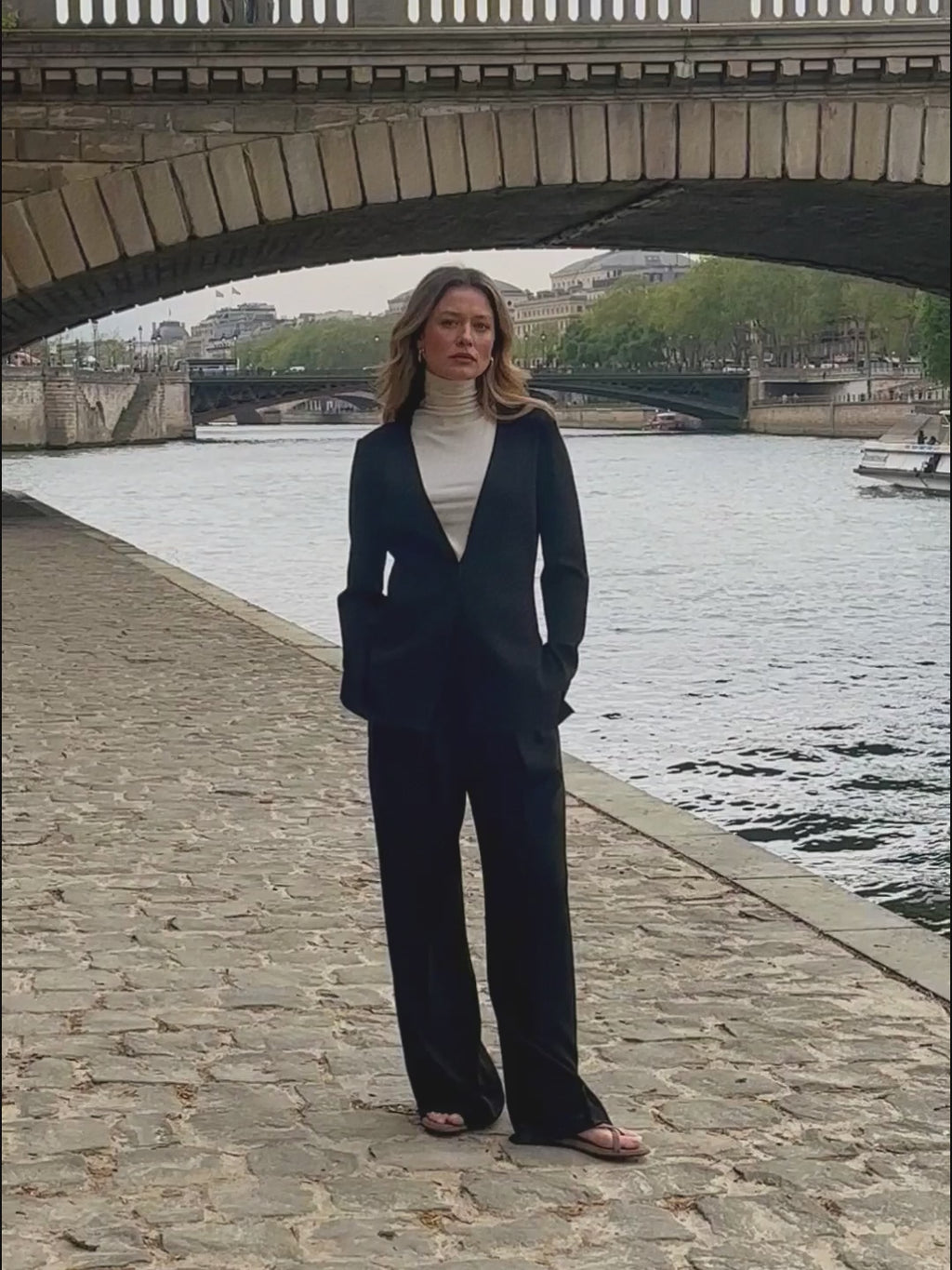 woman in white top and black trousers. 