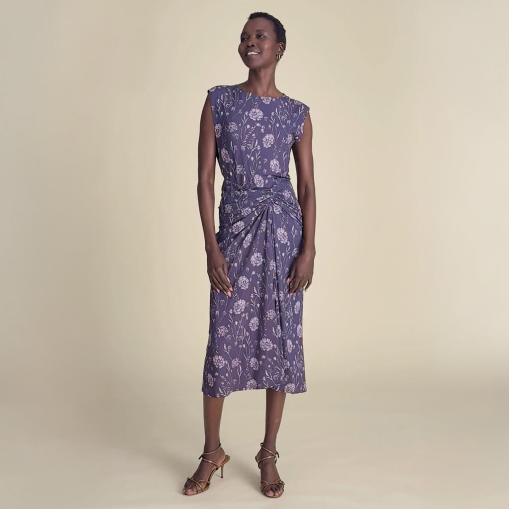 woman in purple pattern dress