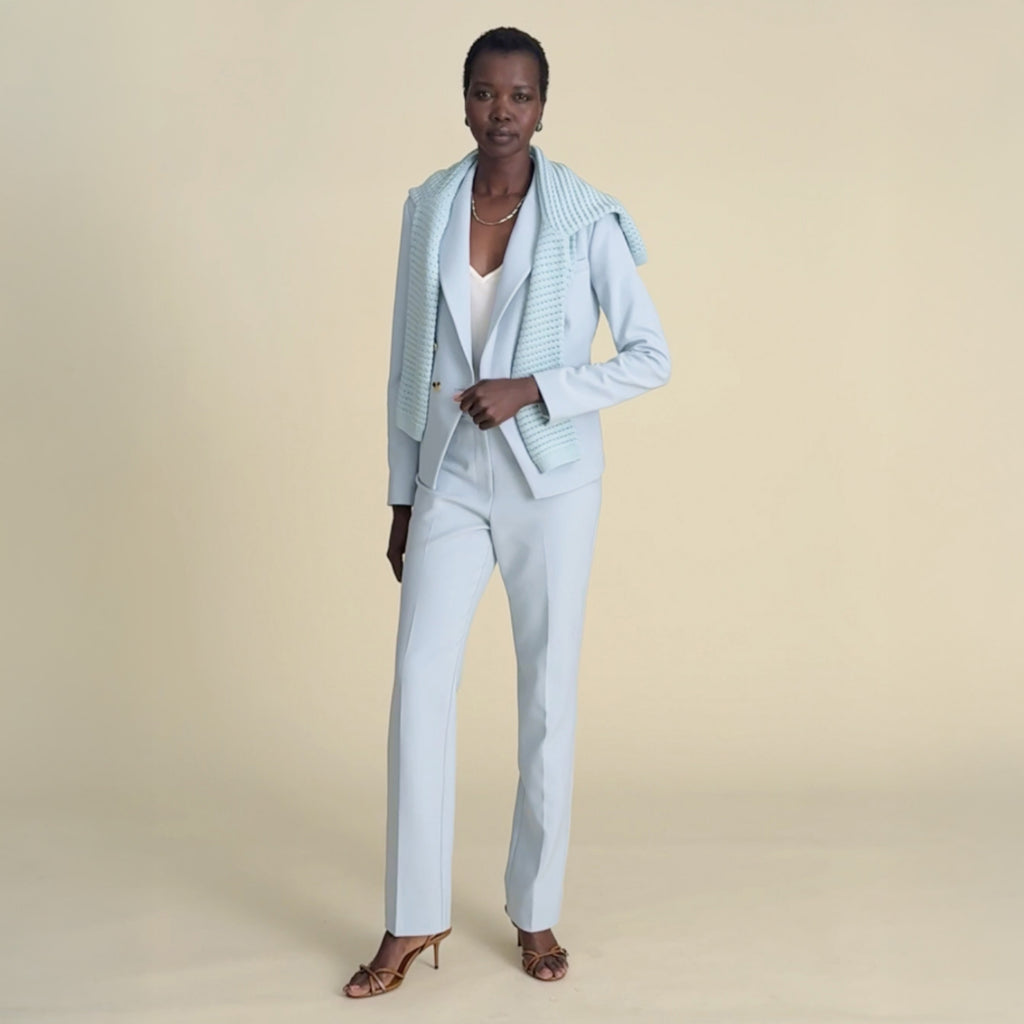 woman in light blue blazer with matching pants