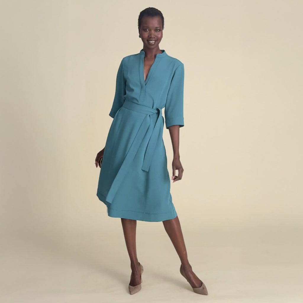 woman in teal dress