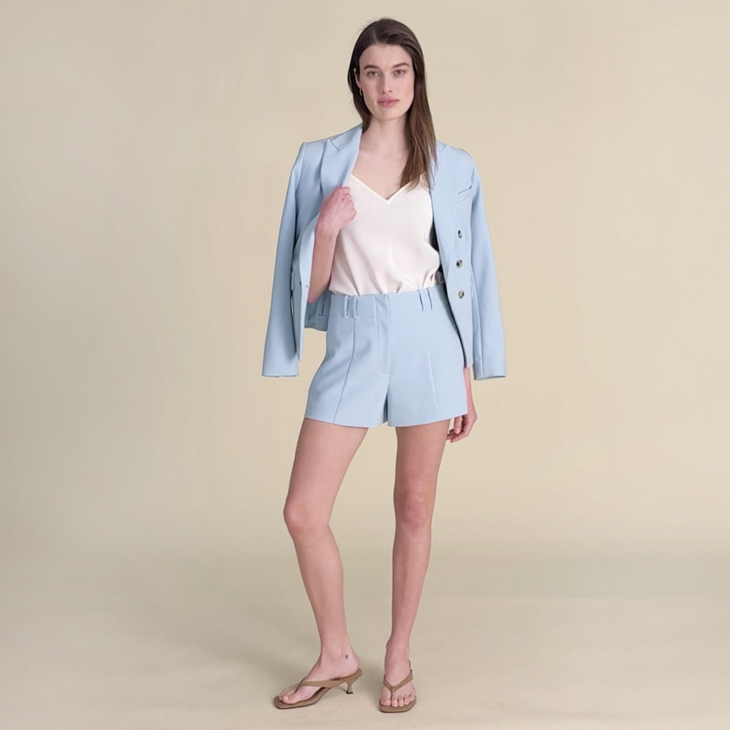 woman in light blue with matching shorts