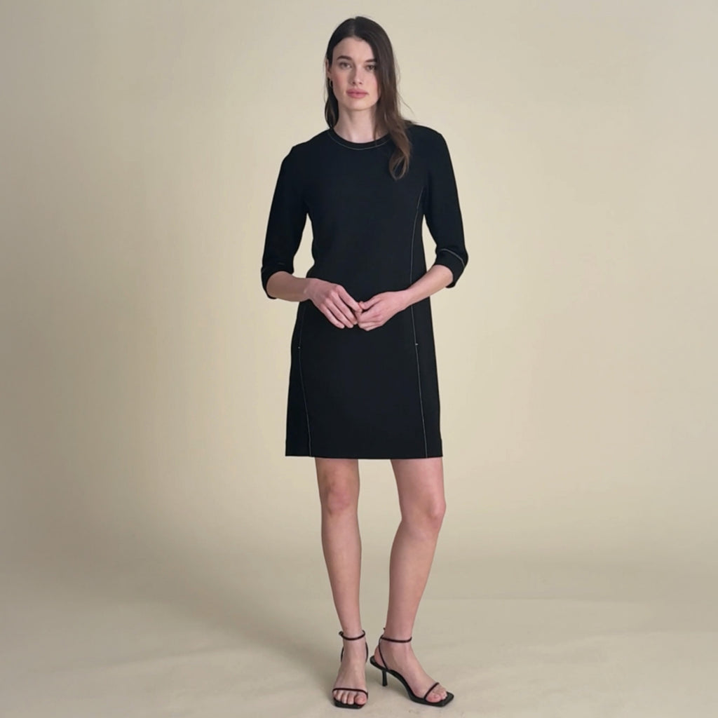 woman in black dress.