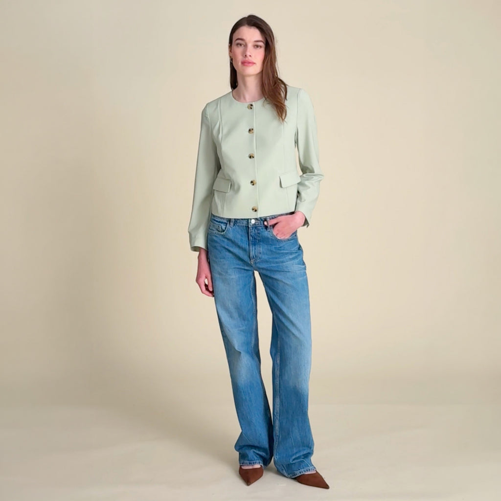 Video of a woman wearing the green Aniya jacket and jeans