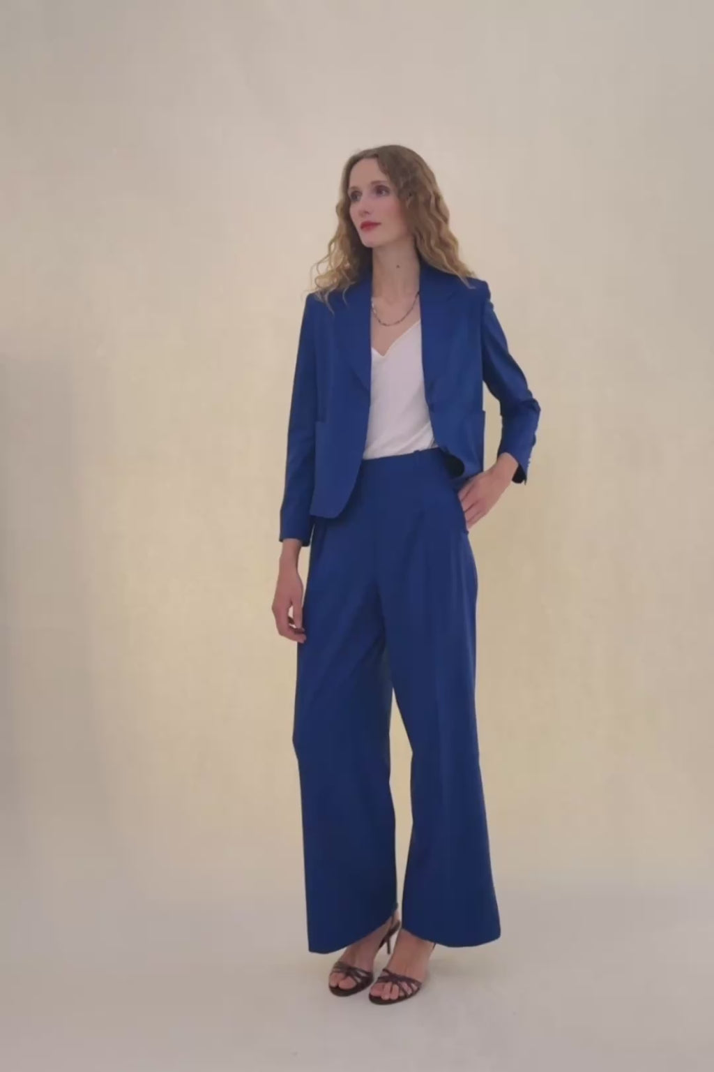 woman in royal blue suit.