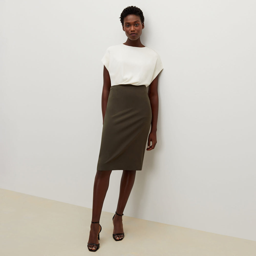 Front image of a woman standing wearing the cobble hill packable suiting in olive