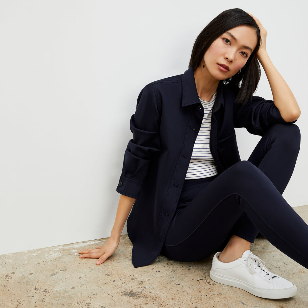 Side image of a woman wearing the Harrington Legging - Light Scuba in Space Blue