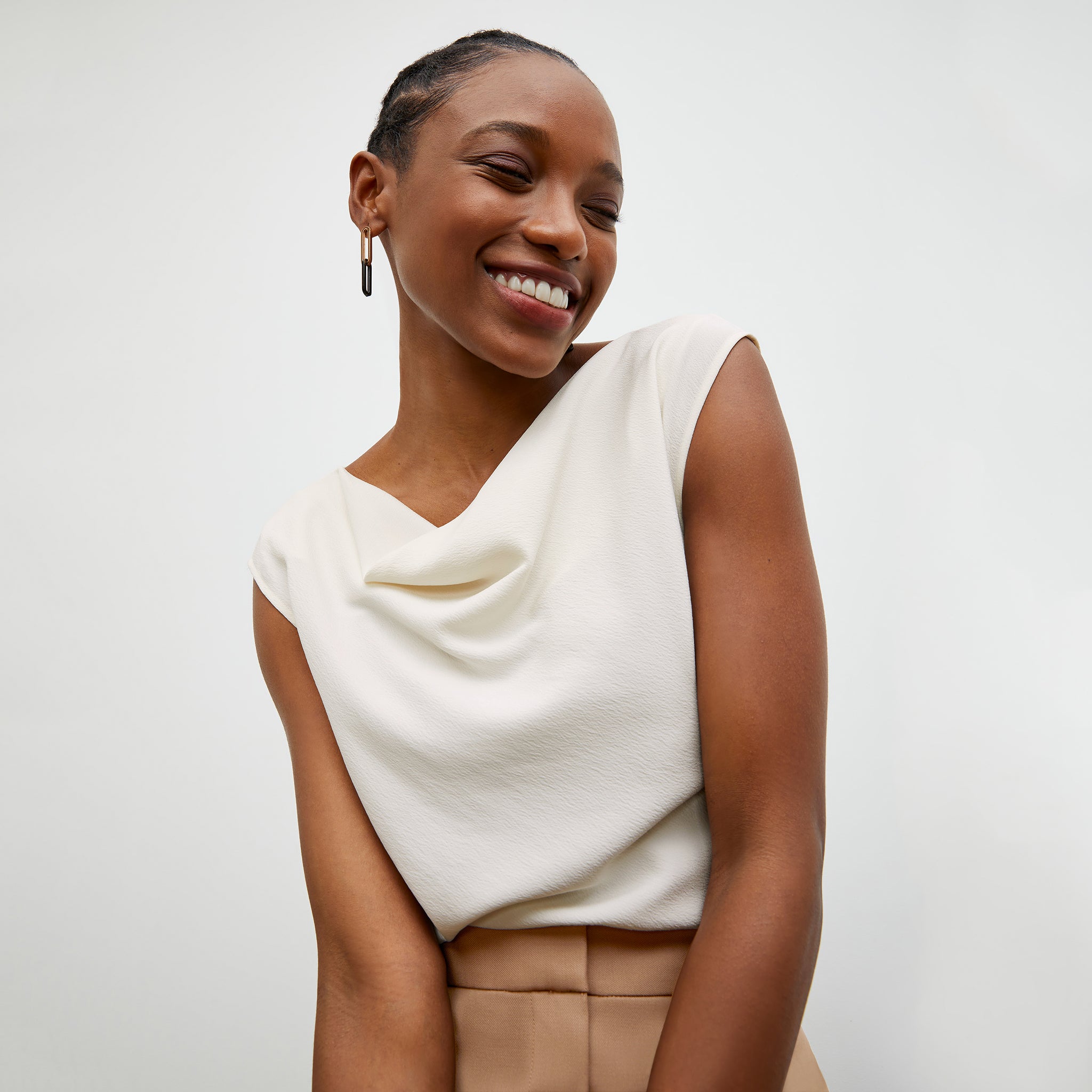 Front image of a woman wearing the Nora Top in Alabaster
