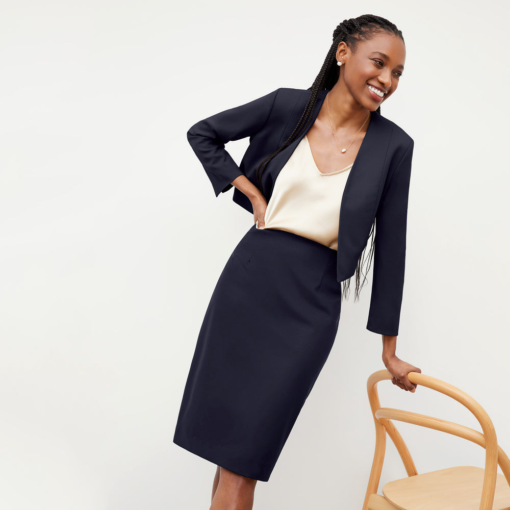 Front image of a woman wearing the Cobble hill skirt in galaxy blue