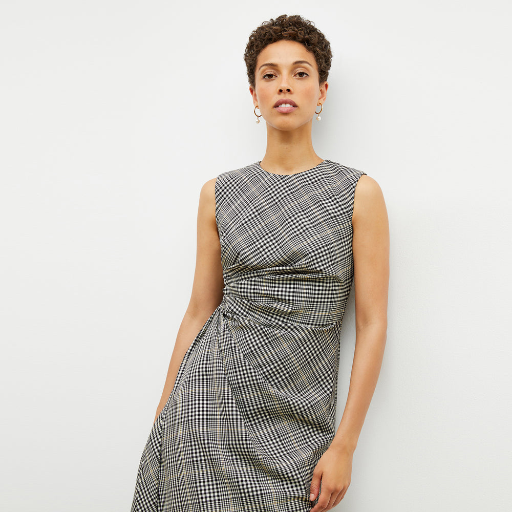 Front image of a woman wearing the jeannine dress in plaid sharkskin