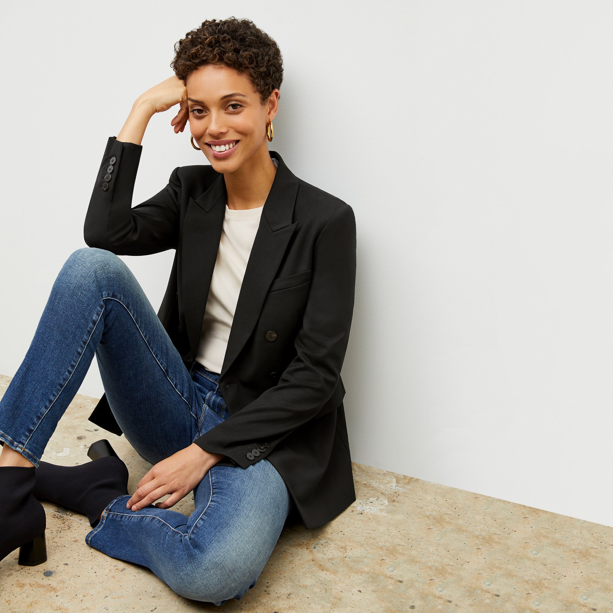 Front image of a woman wearing the kati jacket in black