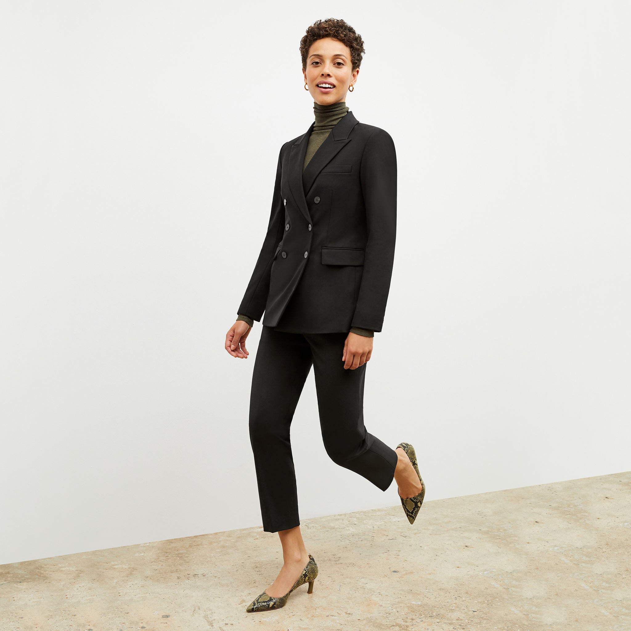 Front image of a woman wearing the kati jacket in black