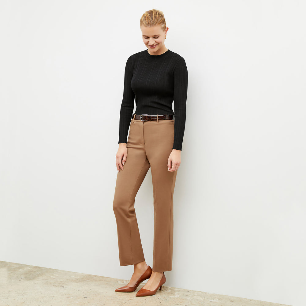 Front image of a woman wearing the smith in camel