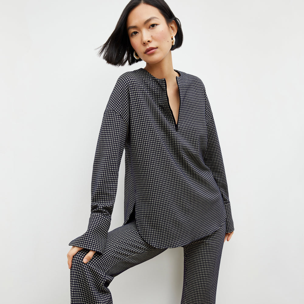 Front image of a woman wearing the tully top in black and white