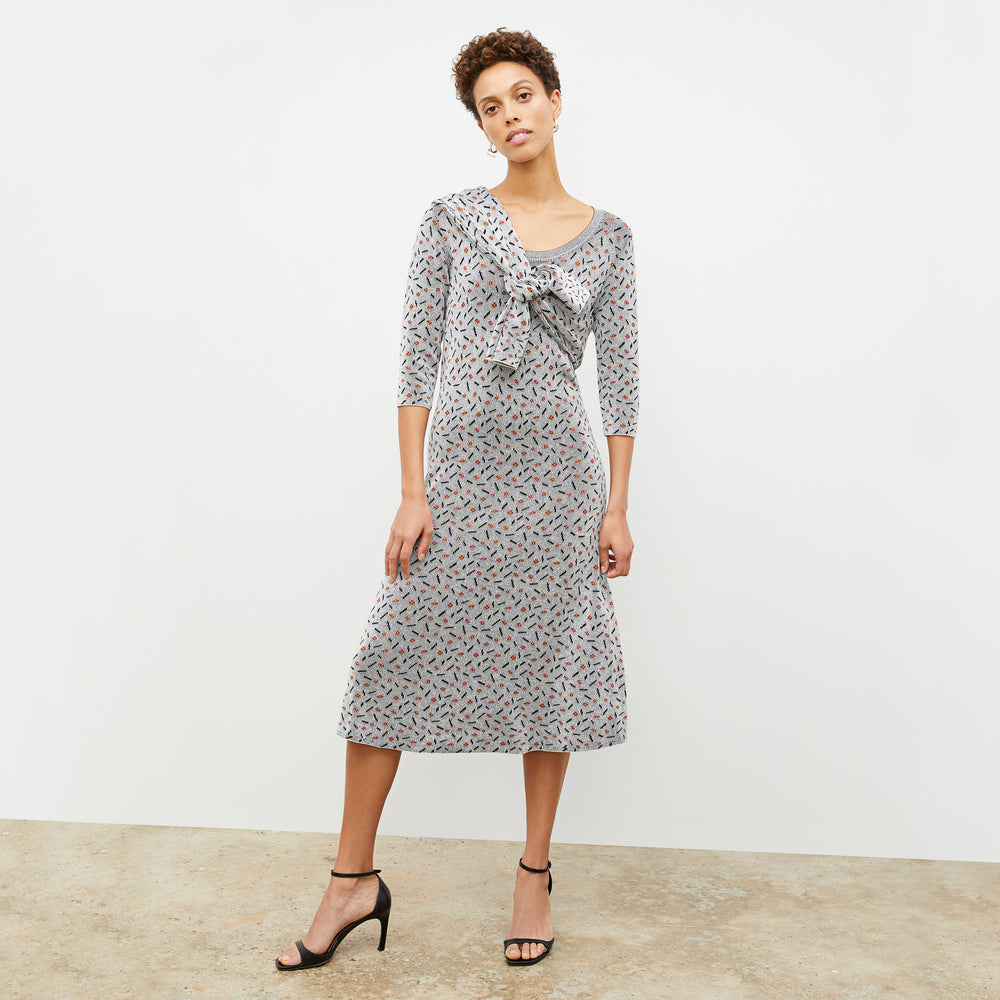 Front image of a woman wearing the Tippy Dress in Brick and Black