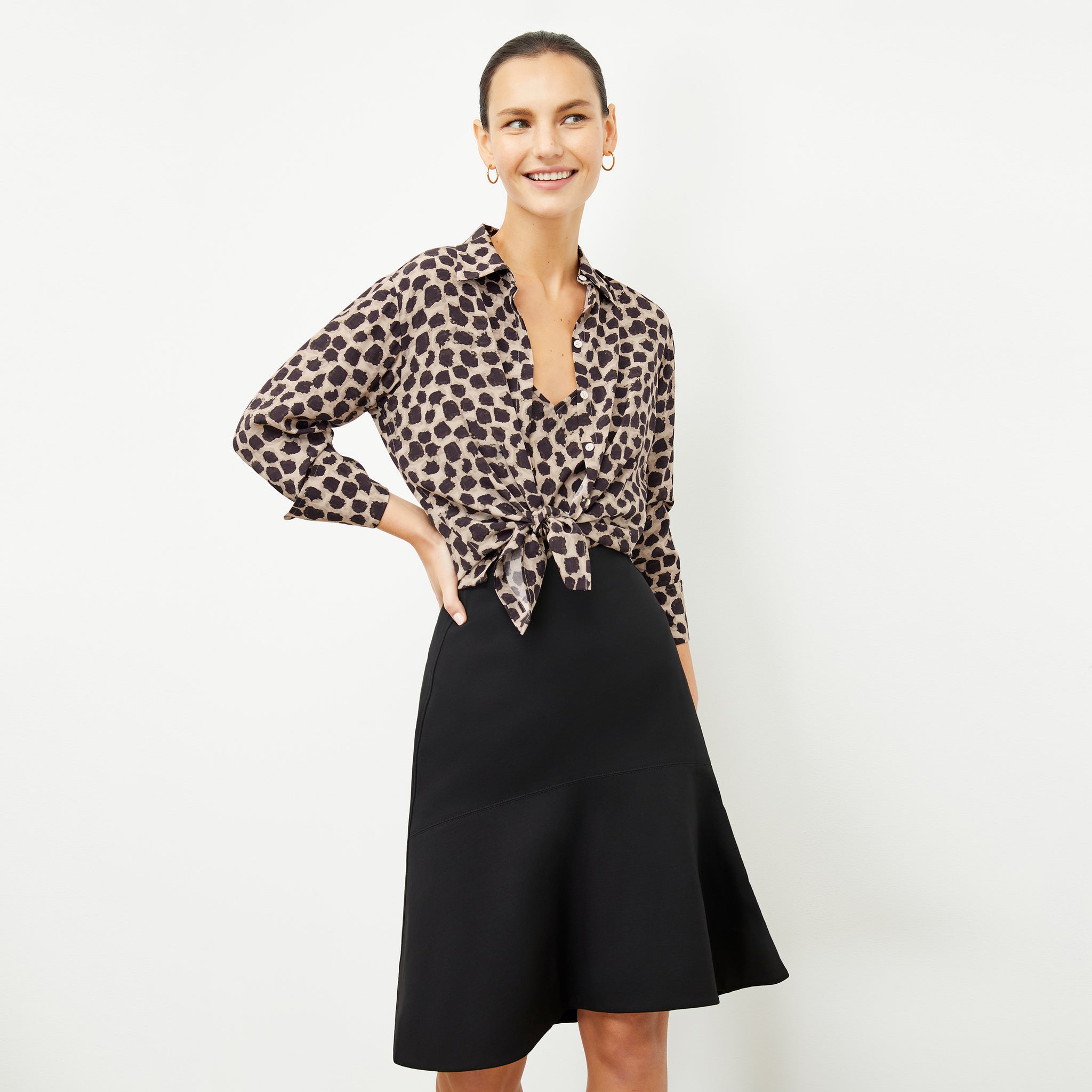 Front image of a woman wearing the tatum shirt in sahara print