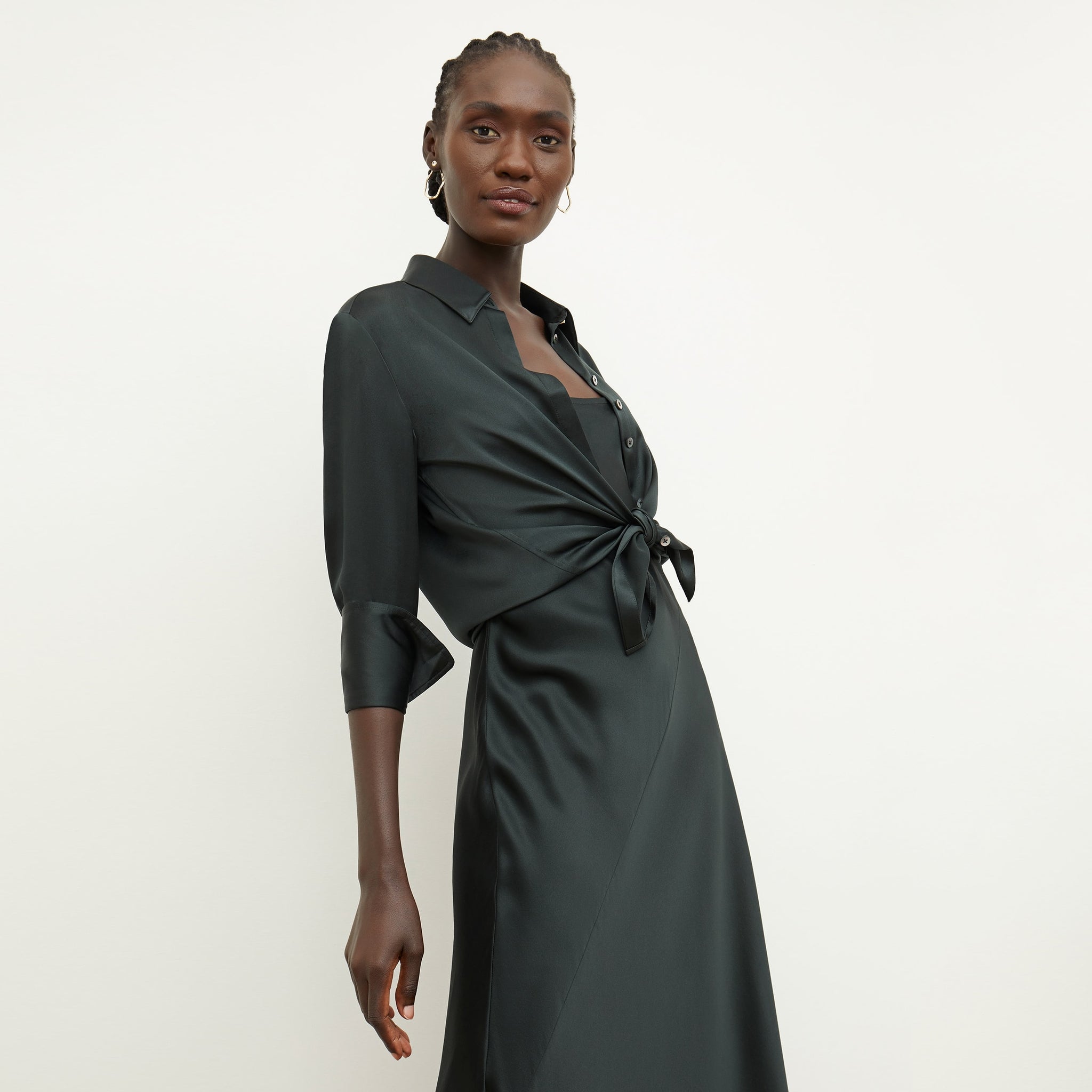 Front image of a woman standing wearing the nene dress in hunter