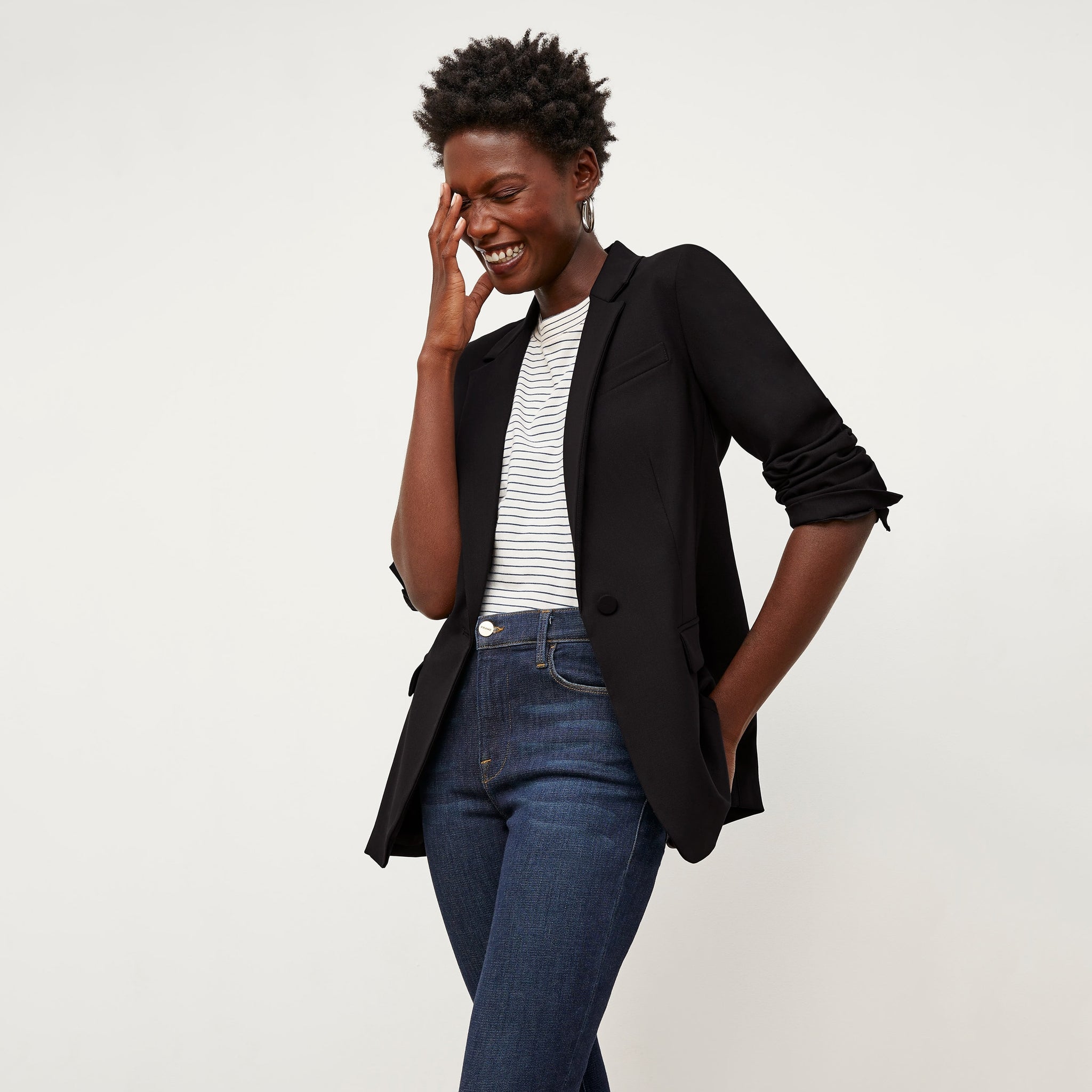 Front image of a woman standing wearing the Yiyan Blazer in Black